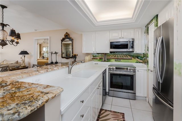 kitchen featuring white cabinets, stainless steel appliances, light tile patterned floors, a notable chandelier, and sink