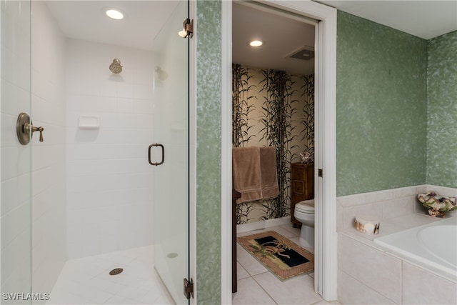 bathroom featuring independent shower and bath, tile patterned floors, and toilet