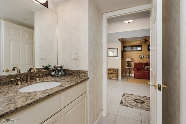 bathroom featuring ceiling fan, tile patterned flooring, and vanity