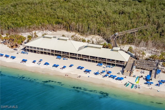 drone / aerial view with a water view and a view of the beach