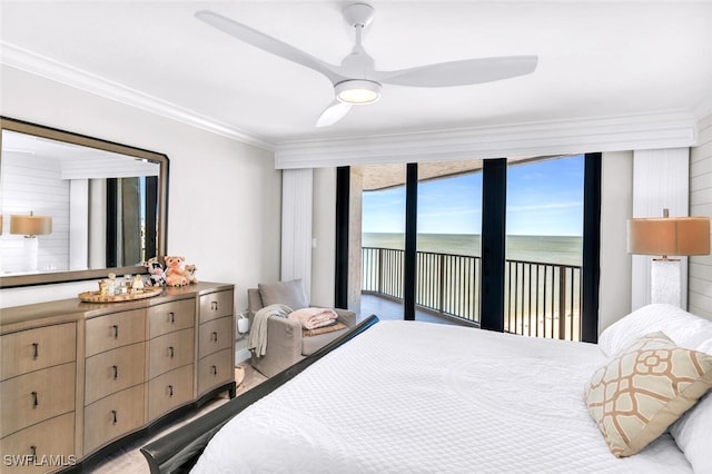 bedroom featuring access to outside, ceiling fan, crown molding, and a water view