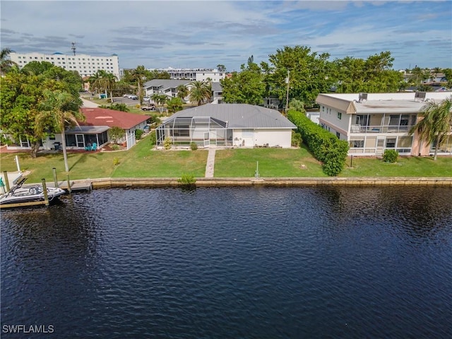 drone / aerial view with a residential view and a water view