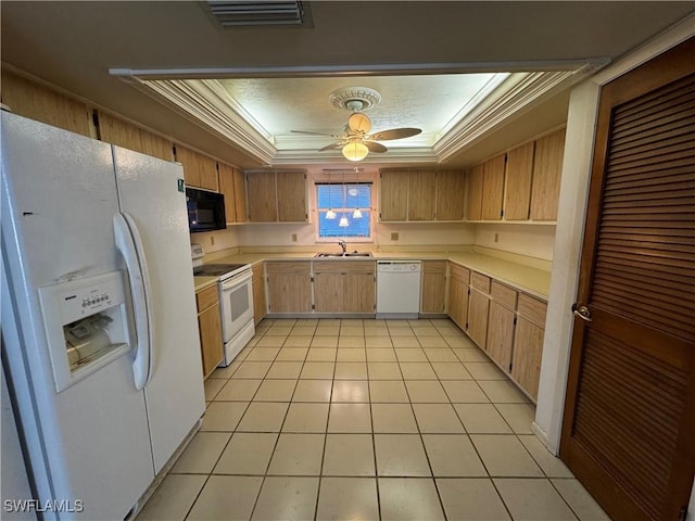 kitchen featuring crown molding, white appliances, light tile patterned floors, a tray ceiling, and ceiling fan