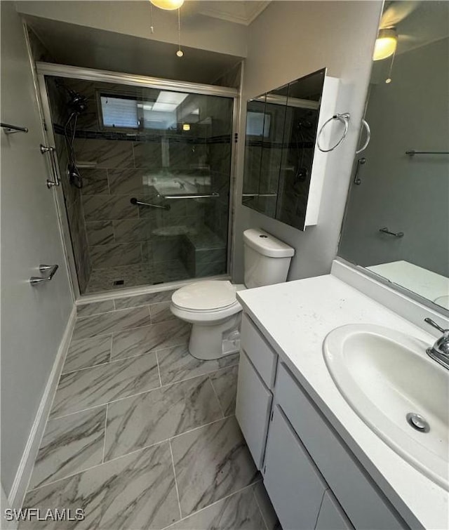 bathroom featuring baseboards, toilet, marble finish floor, vanity, and a shower stall