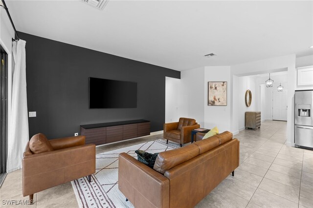 living room featuring light tile patterned flooring