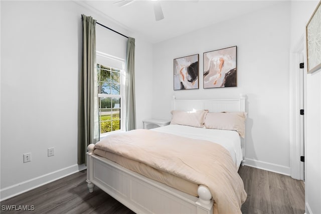 bedroom featuring dark hardwood / wood-style floors and ceiling fan