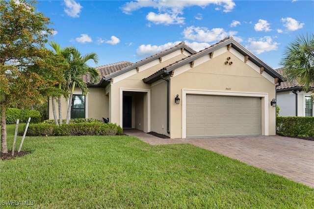 mediterranean / spanish-style home with a garage and a front lawn