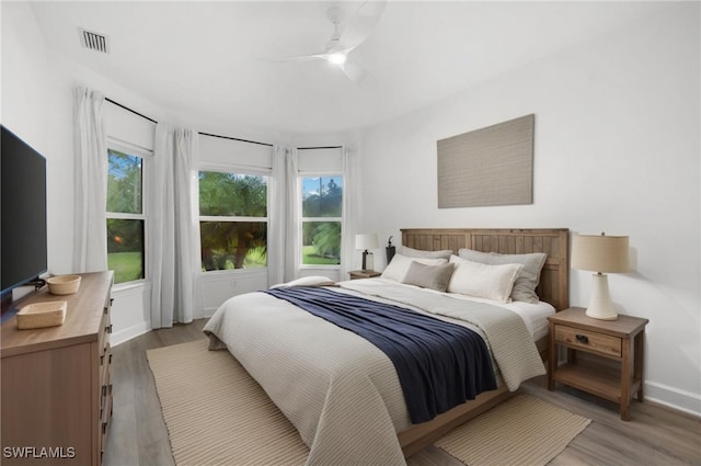 bedroom featuring light wood-type flooring and ceiling fan