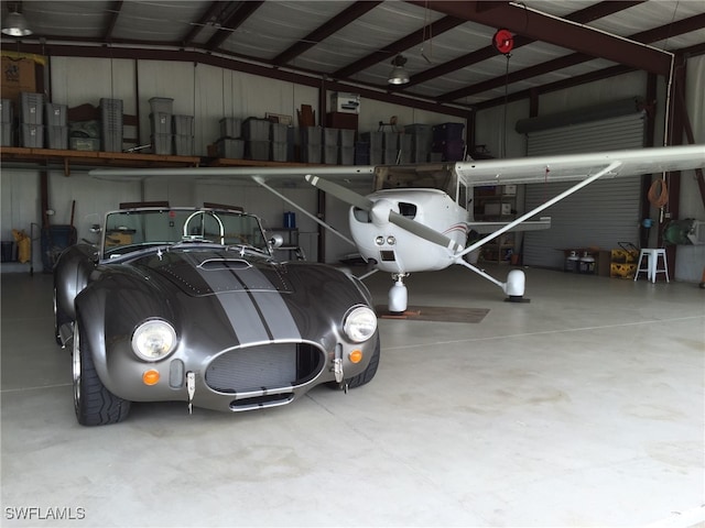 garage featuring a carport