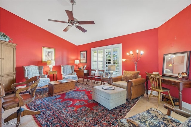 living room with ceiling fan and vaulted ceiling