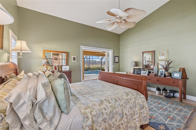 bedroom with access to outside, ceiling fan, high vaulted ceiling, and hardwood / wood-style flooring