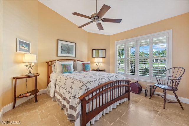 bedroom featuring ceiling fan and vaulted ceiling