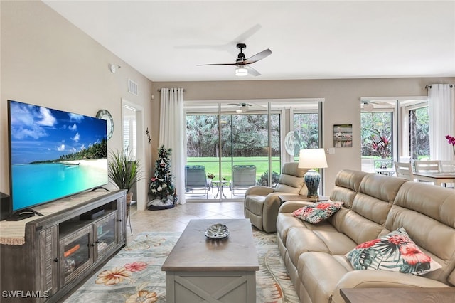 living room with light tile patterned floors and ceiling fan