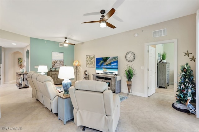 living room featuring ceiling fan and light tile patterned flooring