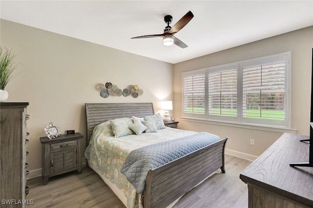 bedroom featuring ceiling fan and light hardwood / wood-style flooring