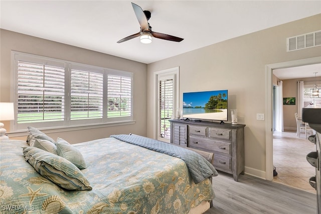 bedroom featuring ceiling fan and light hardwood / wood-style floors