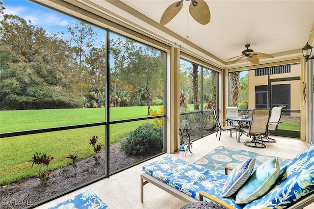 sunroom / solarium with ceiling fan