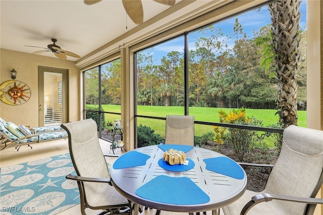 sunroom featuring ceiling fan