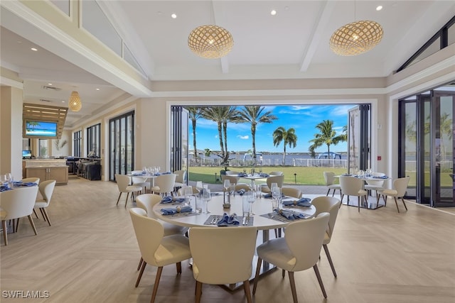 dining space with beamed ceiling and high vaulted ceiling