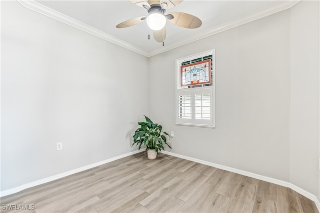 spare room featuring baseboards, light wood-style floors, ornamental molding, and a ceiling fan