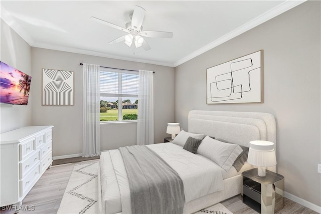 bedroom featuring light wood-type flooring, crown molding, and baseboards