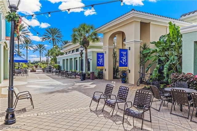 view of home's community with a patio area