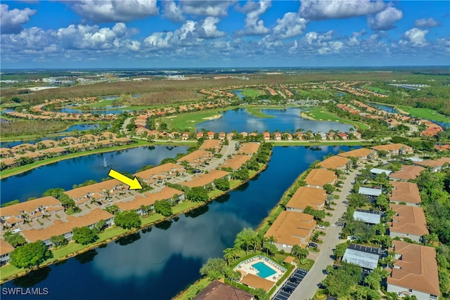 birds eye view of property with a water view