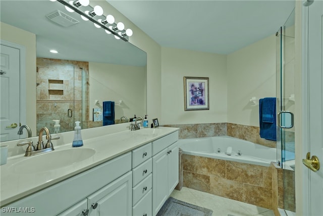 bathroom featuring tile patterned floors, vanity, and independent shower and bath