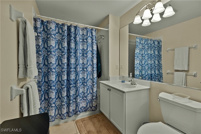 bathroom featuring vanity, a shower with shower curtain, and toilet