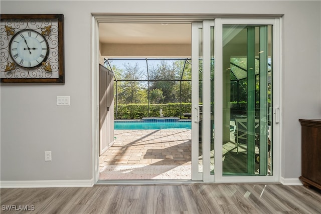 doorway to outside with light hardwood / wood-style floors