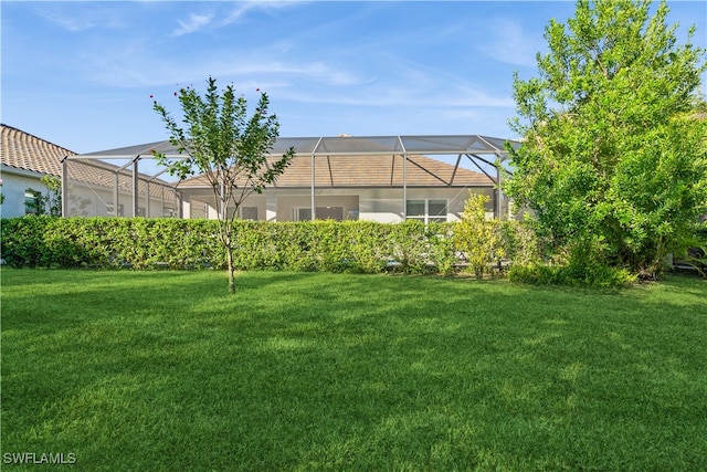 view of yard featuring glass enclosure