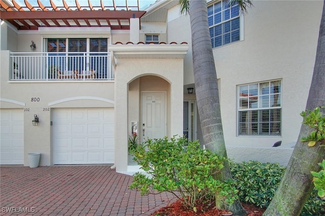 doorway to property with a garage