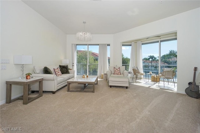 living room featuring a notable chandelier and light carpet