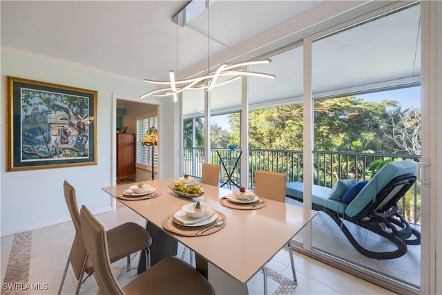 dining room with light tile patterned floors and a notable chandelier