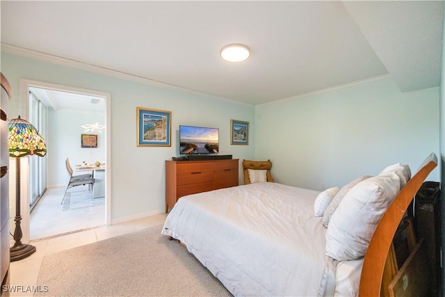 bedroom featuring light tile patterned floors and crown molding