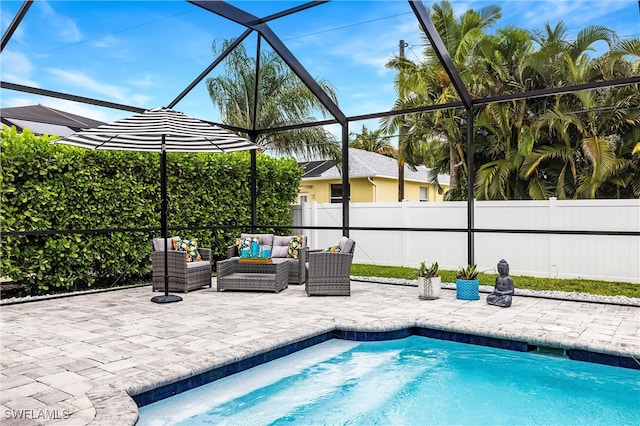 view of pool featuring an outdoor living space, glass enclosure, and a patio