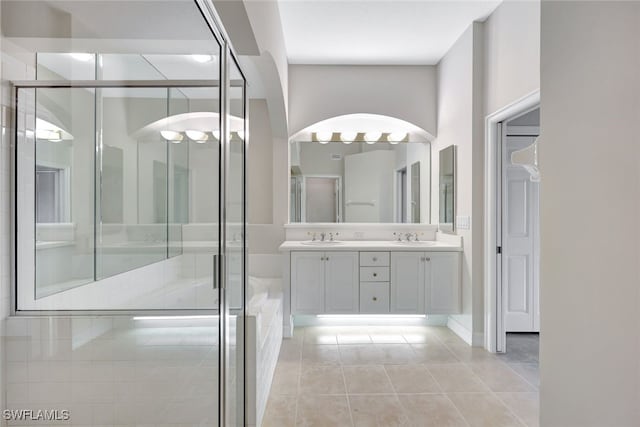 bathroom featuring tile patterned floors, vanity, and walk in shower