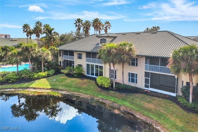 back of house featuring a water view