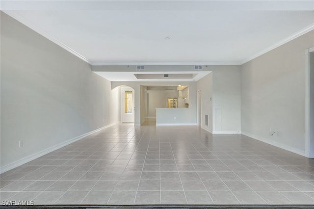 tiled spare room with ornamental molding