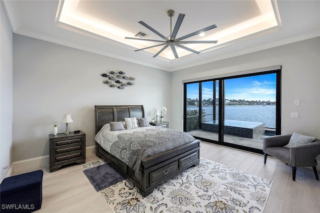 bedroom featuring ceiling fan, light wood-type flooring, access to outside, a water view, and ornamental molding