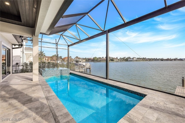 view of swimming pool featuring a patio, a water view, a dock, and glass enclosure