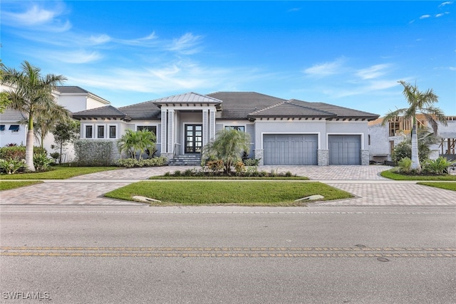 view of front of home featuring a garage and french doors