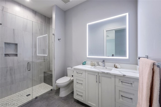 bathroom with vanity, toilet, and walk in shower