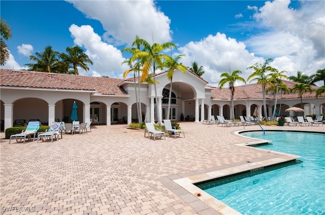 view of swimming pool with a patio