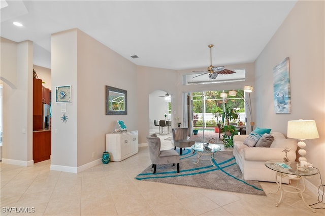 living room featuring light tile patterned floors and ceiling fan