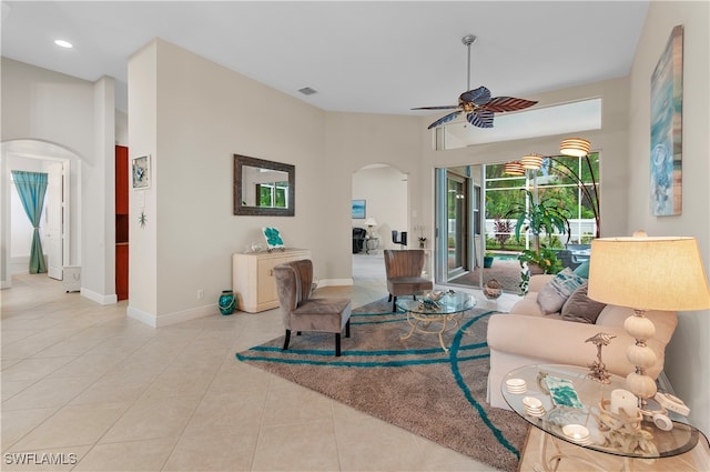 living room with ceiling fan and light tile patterned floors