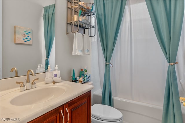 full bathroom with shower / bath combination with curtain, vanity, and toilet