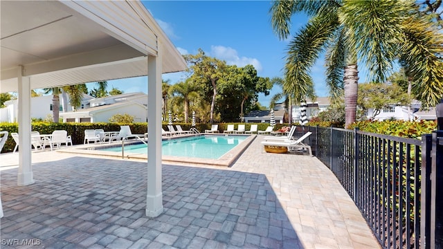 view of swimming pool featuring a patio area