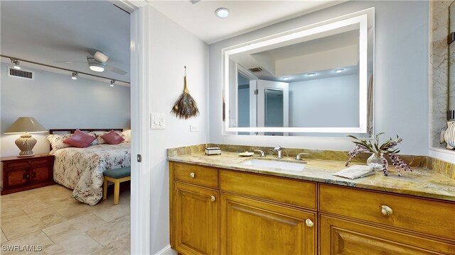 bathroom with vanity, ceiling fan, and rail lighting