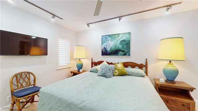 bedroom featuring ceiling fan and rail lighting